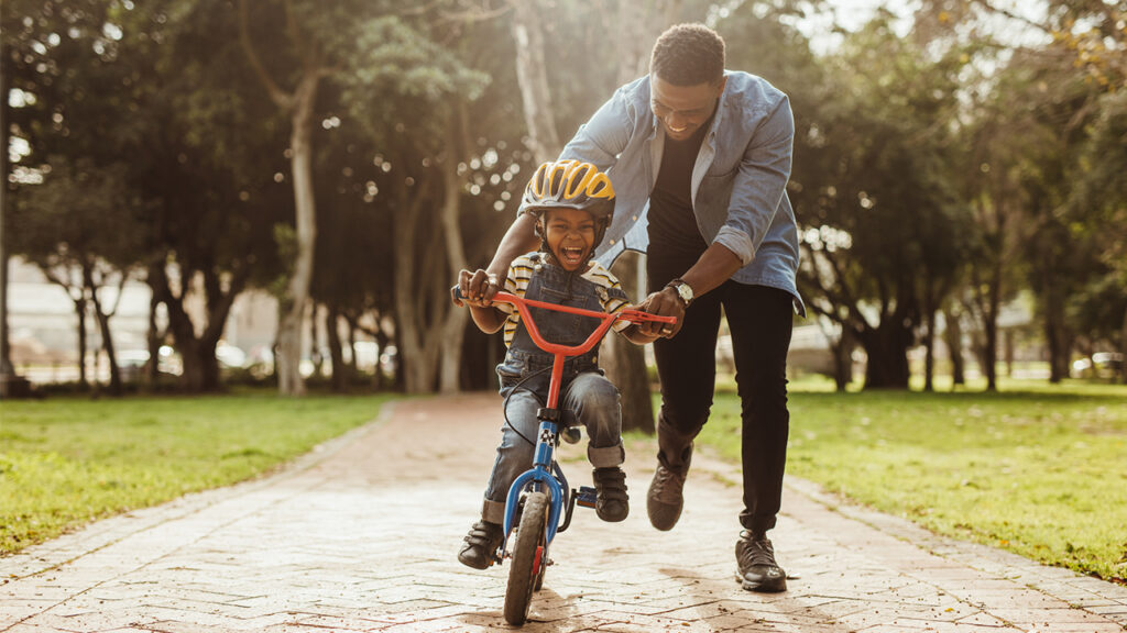 how to help a child to ride a bike